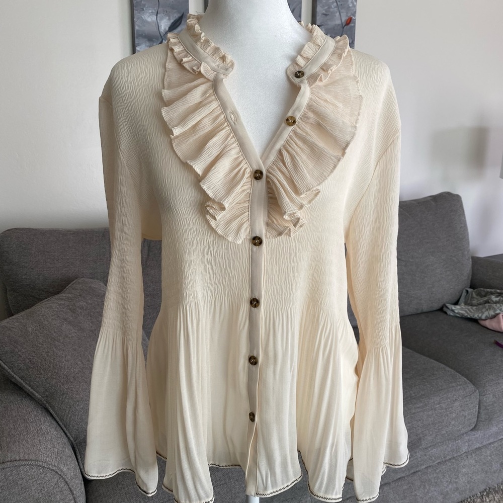 Anthropologie ruffle bell sleeve top.